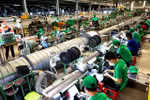 A company in HCM City. With new orders rising sharply, manufacturers ramped up production in July. (Photo: VNA)