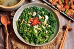 Rau muong xao toi (morning glory stir-fry) is included in top 100 Asian stir-fry dishes of TasteAtlas. (Photo: Com Nha Facebook)