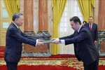 Pakistani Ambassador Kohdayar Marri (right) presents his credentials to President To Lam in Hanoi on June 18. (Photo: VNA)