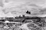 The "Determined to fight, determined to win" flag of the Vietnam People's Army flies on the top of French General De Castries' bunker in the afternoon of May 7, 1954, marking the complete victory of the Dien Bien Phu Campaign. (File photo: VNA)