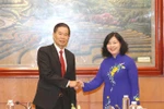 Vietnam, Laos step up experience exchange on mass mobilisation 