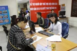 Supports desks for taxpayers at Hanoi Taxation Department. Photo: VNA