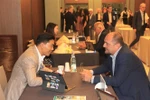 Representatives from Vietnamese and Italian tourism businesses meet at the tourism promotion programme in Milan, Italy. (Photo: VNA)