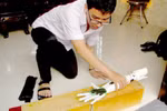 Student invents robotic arm for the disabled