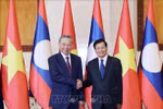 President To Lam (L) and General Secretary of the Lao People’s Revolutionary Party (LPRP) and President of Laos Thongloun Sisoulith hold talks in Vientiane on July 11 (Photo: VNA)