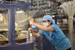 The garment and textile sector is urged to apply advanced technologies to improve productivity. (Photo: VNA)