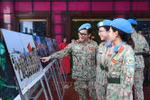 Female soldiers visit the photo exhibition (Photo: VNA)