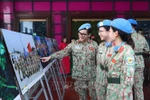 Female soldiers visit the photo exhibition (Photo: VNA)