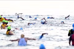 Athletes participate in swimming event at IRONMAN 70.3 Da Nang 2025 (Photo: VNA)