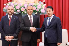 Minister of Public Security General Luong Tam Quang (right) receives Vice Chairman of the Board and Co-founder of ICT Murat Kaya and ANVI Chairman Adalat Bakhisov in Hanoi on October 5, 2026. (Photo: VNA)