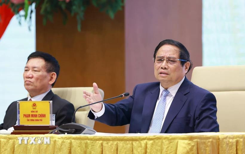 Prime Minister Pham Minh Chinh speaks at the meeting with SOEs in Hanoi on April 15. (Photo: VNA)