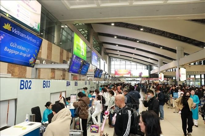 Check-in counters at a Vietnamese airport (Photo: VNA)