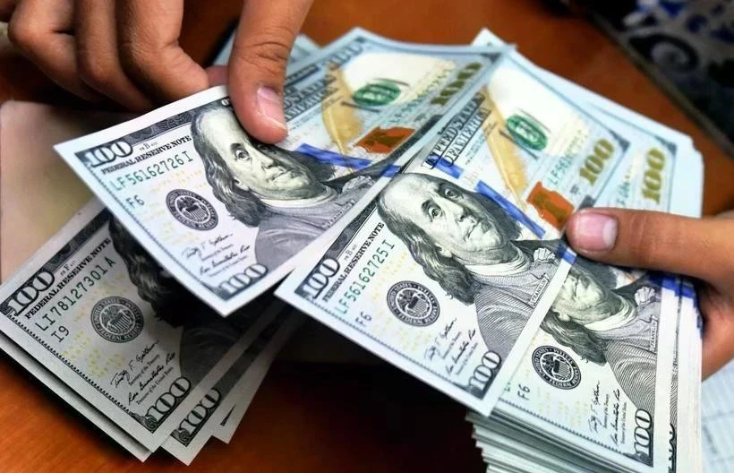 The State Bank of Vietnam set the daily reference exchange rate for the US dollar at 24,638 VND/USD on February 21 (Photo: VNA)