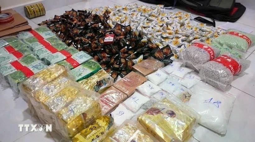 Evidence seized in a crackdown obn a drug trafficking ring that transported and traded more than 30kg of various drugs from Cambodia to Ho Chi Minh City. (Photo published by VNA)