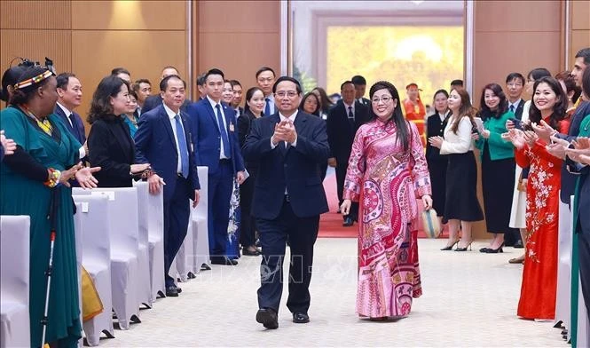 PM Pham Minh Chinh and his spouse at the banquet. (Photo: VNA)