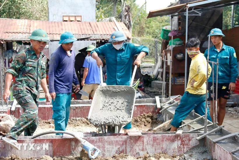 Construction underway on a house (Photo: VNA)