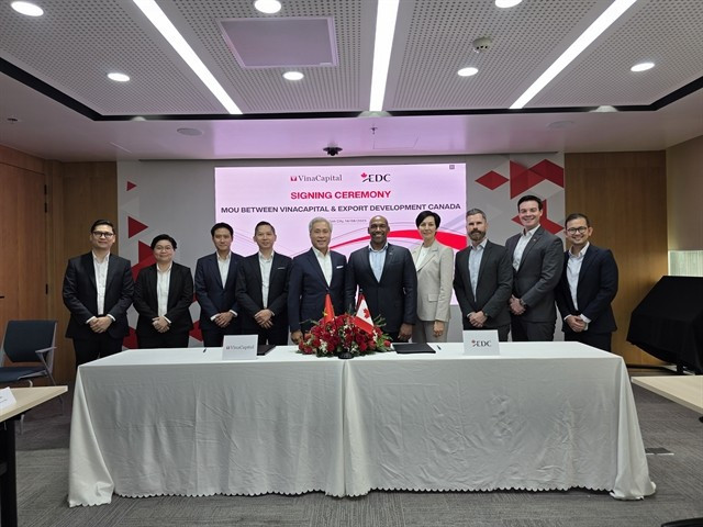 The MoU signing ceremony between Export Development Canada (EDC) and VinaCapital in HCM City on August 14. (Photo courtesy of the Consulate General of Canada in HCM City)