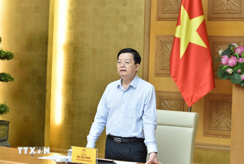 Deputy Prime Minister Mai Van Chinh, head of the steering committee for the national exhibition marking the 80th anniversary of Vietnam’s National Day, speaks at the hybrid meeting with relevant ministries, agencies, and provincial authorities on July 25. (Photo: VNA)