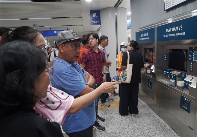 Passengers wait to buy tickets on Metro Line 1 in HCM City (Photo: VNA)