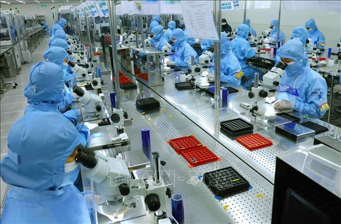 A production line of camera modules and electronic components for export at the factory of MCNEX VINA Co., Ltd of the Republic of Korea in Phuc Son Industrial Park, Ninh Binh province. (Photo: VNA)