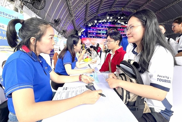 People take part in a job fair in HCM City to seek suitable work. (Photo: VNA)