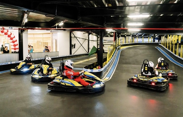 Racers take off at Infinity Racing’s newly launched indoor multi-level Go-Kart track in HCM City, the first of its kind in Vietnam (Photo: VNA)