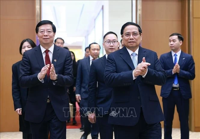 PM Pham Minh Chinh (R) and Prof. Dr. Qiu Yong, Secretary of the Tsinghua University’s Party Committee and Academician of the Chinese Academy of Sciences. (Photo: VNA)