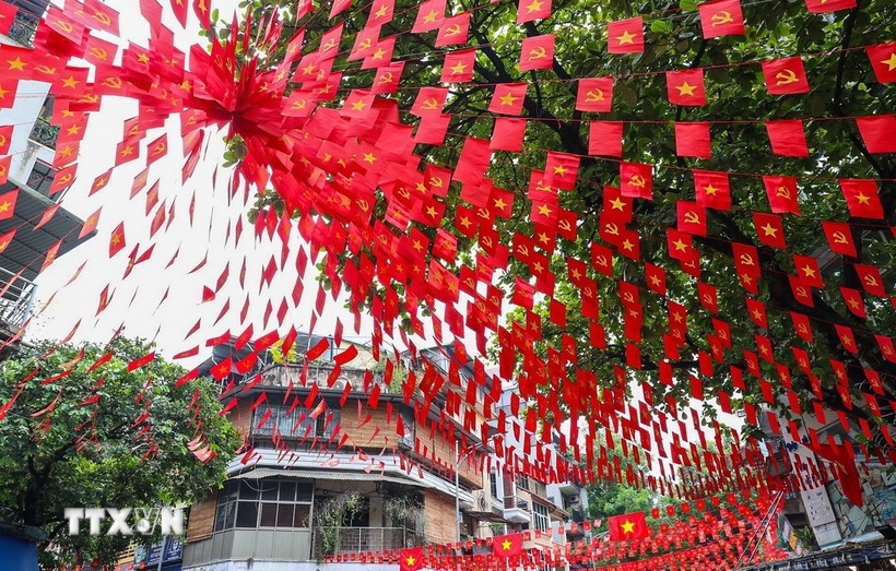 A street in Hanoi filled with the national flags. (Photo: VNA)