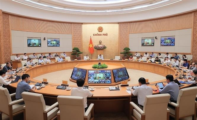 Participants at the meeting (Photo: VNA)