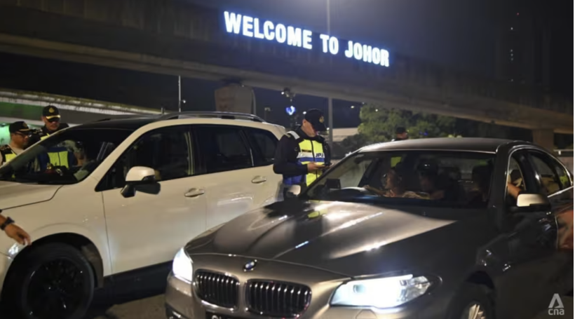 Singapore-registered vehicles without valid Vehicle Entry Permit tags or unactivated ones are stopped by Malaysia Road Transport Department officers just past midnight on July 1, 2025. (Photo: CNA/ Zamzahuri Abas)