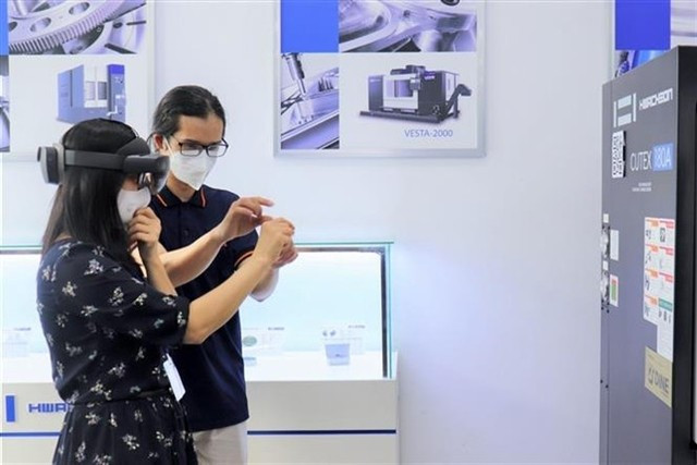 A client experiences VR technology at a tech centre in HCM City. (Photo: VNA)