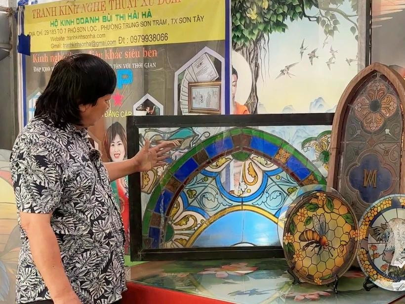 Artisan Pham Hong Vinh has spent over three decades on developing his art of enamelled glass. (Photo: VietnamPlus)