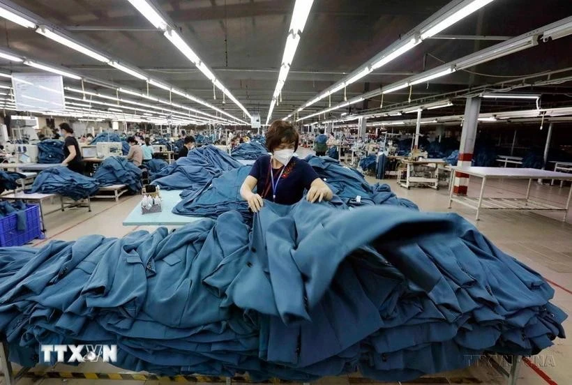 Sewing goods for export to the Spanish market at Ho Guom garment company in Hung Yen province. (Photo: VNA)