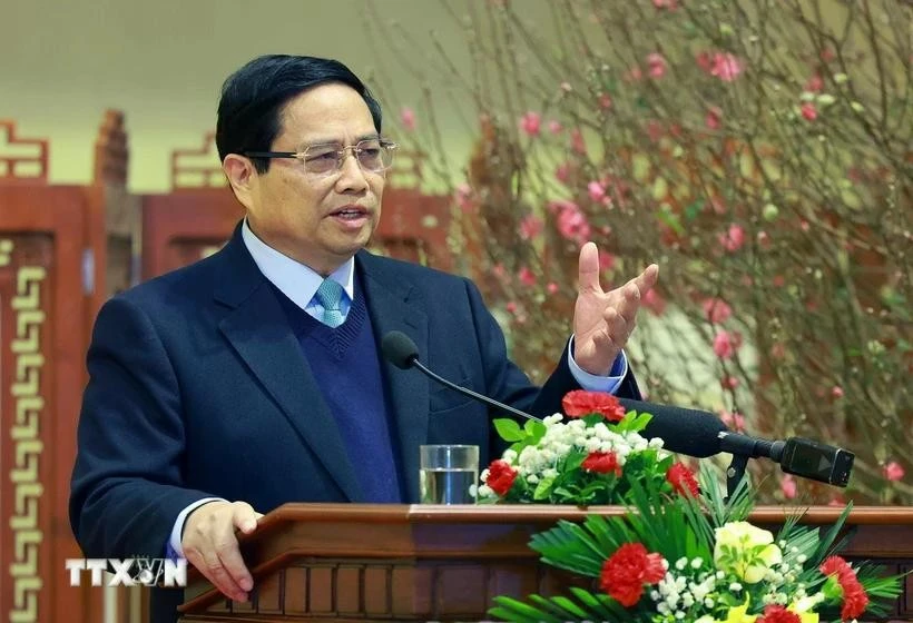 Prime Minister Pham Minh Chinh extends new year wishes to the banking sector at a meeting on February 3. (Photo: VNA)