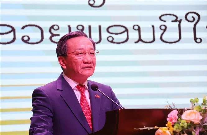 Vietnamese Ambassador to Laos Nguyen Minh Tam speaks at the get-together. (Photo: VNA)