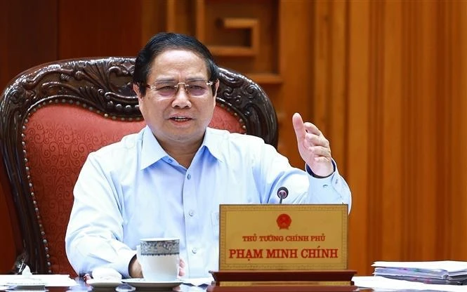 Prime Minister Pham Minh Chinh addresses the meeting to discuss promoting fair and sustainable trade relations with the US on April 22 (Photo: VNA)