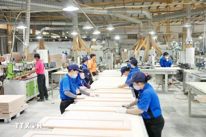 Production activities at the factory of the Italian-Asian Door Industry Company Limited in Tan Uyen city (Binh Duong). (Photo published by VNA)