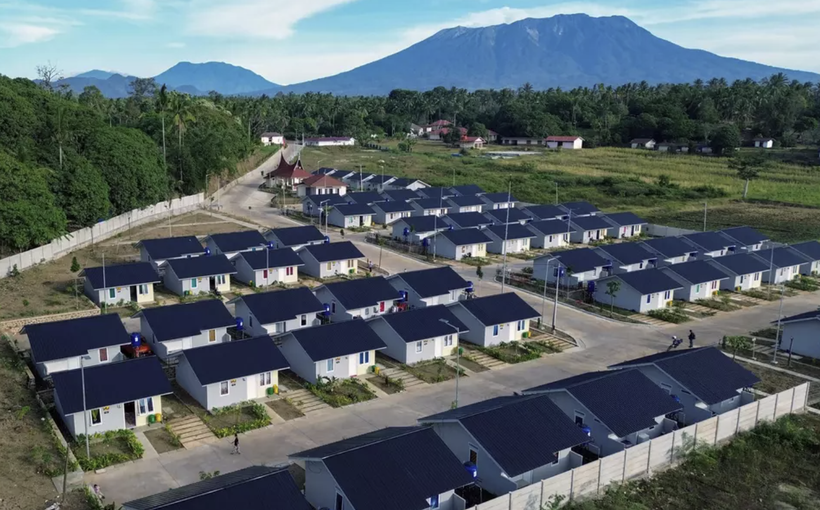 This aerial photo shows rows of houses with Mt. Marapi in the background in Nagari Rambatan, West Sumatra, Sunday, July 20, 2025. The houses were built by the government to accommodate victims of the Marapi eruption. (Antara Photo/Iggoy el Fitra)
