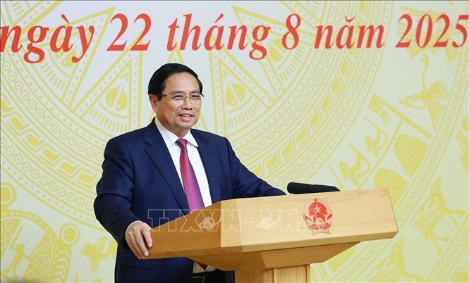 Prime Minister Pham Minh Chinh speaks at the coneference on August 22, 2025. (Photo: VNA)