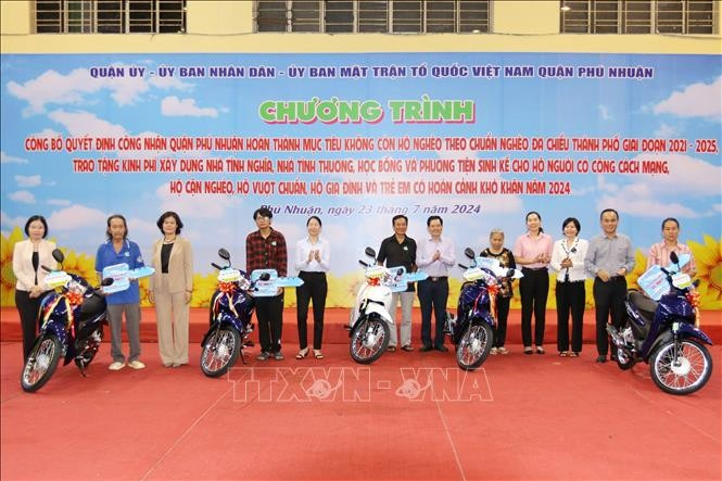 Near-poor and disadvantaged households in HCM City’s Phu Nhuan district receive motorbikes as a means of livelihood. (Photo: VNA)