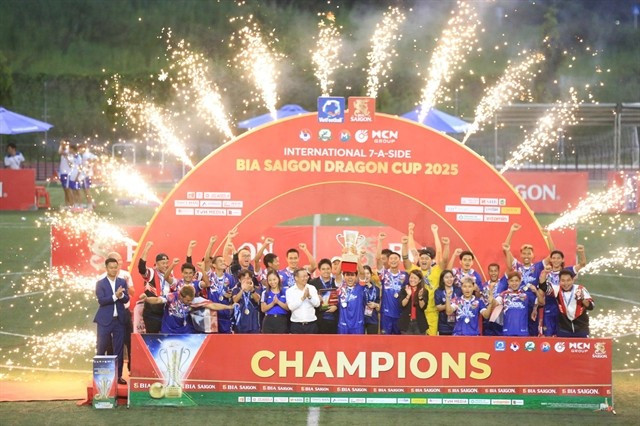 Thailand players and officials celebrate their International Seven-a-side Football Tournament victory. (Photo of VietFootball)