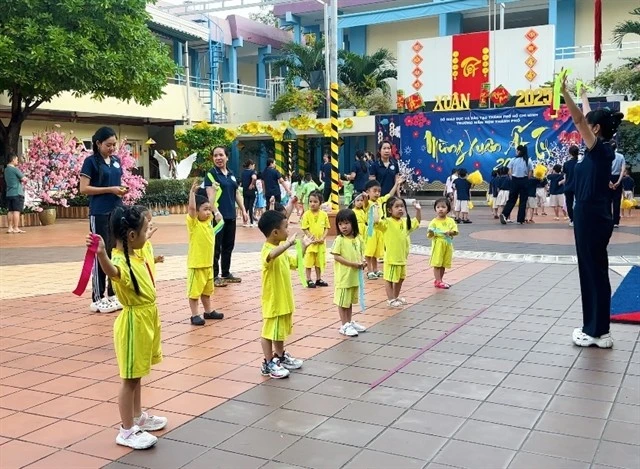 Students participating in outdoor activities at a HCM City kindergarten in District 3. The city promotes building happy schools. (Photo: VNA)