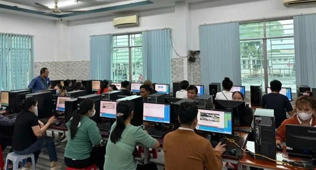 People take the test on computers for A1 driving licence in Tây Ninh province. (Photo: VNA)