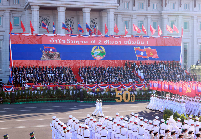 A military parade and march held to celebrate the 50th National Day of the Lao People’s Democratic Republic. (Photo: VNA)