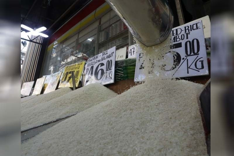 Rice dealers display rice and their prices at Trabajo Market in Sampaloc, Manila. (Photo: philstar.com)