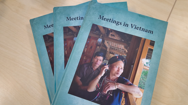 Mrs Binh appears on the cover of the photo book “Meetings in Vietnam.” (Photo: VietnamPlus)