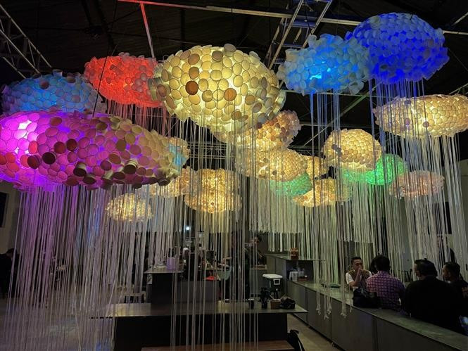 Paper cups are used to make unique chandeliers displayed at the Bandung Design Biennale 2025. (Photo: VNA)