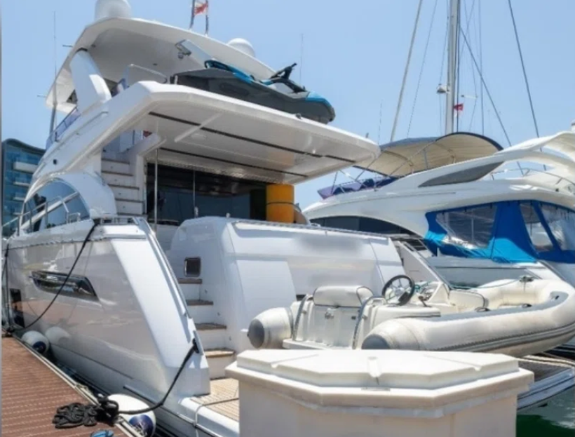 The assets tied to the Cambodia scam syndicate include a yacht, 11 cars and multiple bottles of liquor. (Photo: Singapore Police Force)