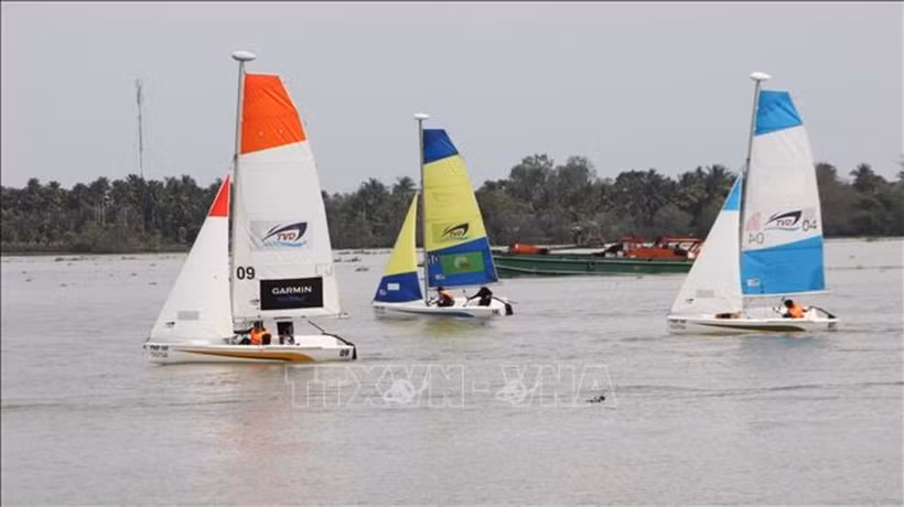 Sailing teams compete on the Hau River. (Photo: VNA)