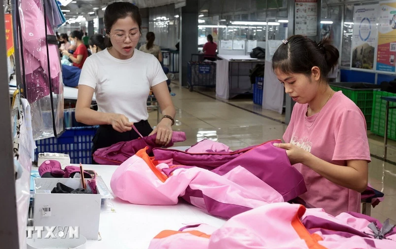 Garments for export to the EU market being produced at TNG Garment Corporation. (Photo: VNA)